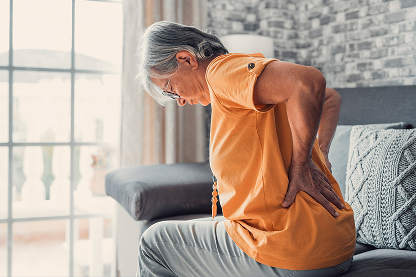 senior woman with lower back pain. 